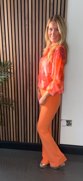 Orange flare trousers